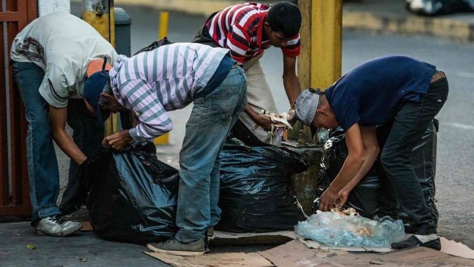 People scavenging for food in the streets of Caracas