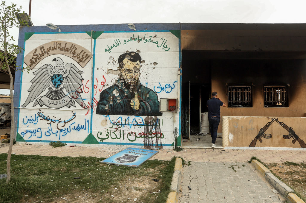 A defaced mural of Mohsen, who served as "minister of defence", at the brothers' detention centre