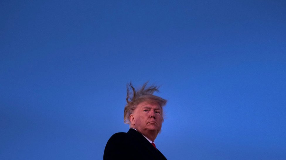 US President Donald Trump boards Air Force One at Andrews Air Force Base as the US House of Representatives debates his impeachment on December 18, 2019, in Maryland.