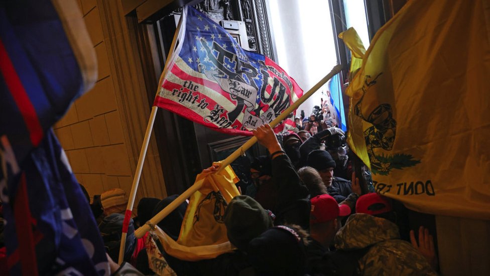 Mob forcibly entering the US Capitol building