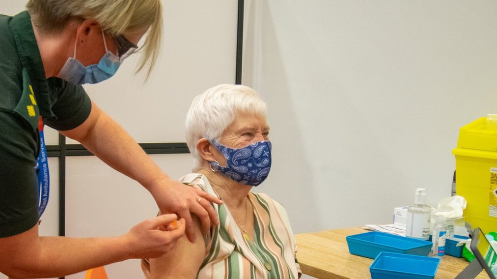 Elderly woman receives Covid vaccine