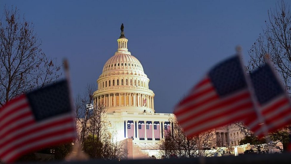 US flags can be seen near the Capitol Building in Washington, DC on January 19, 2021