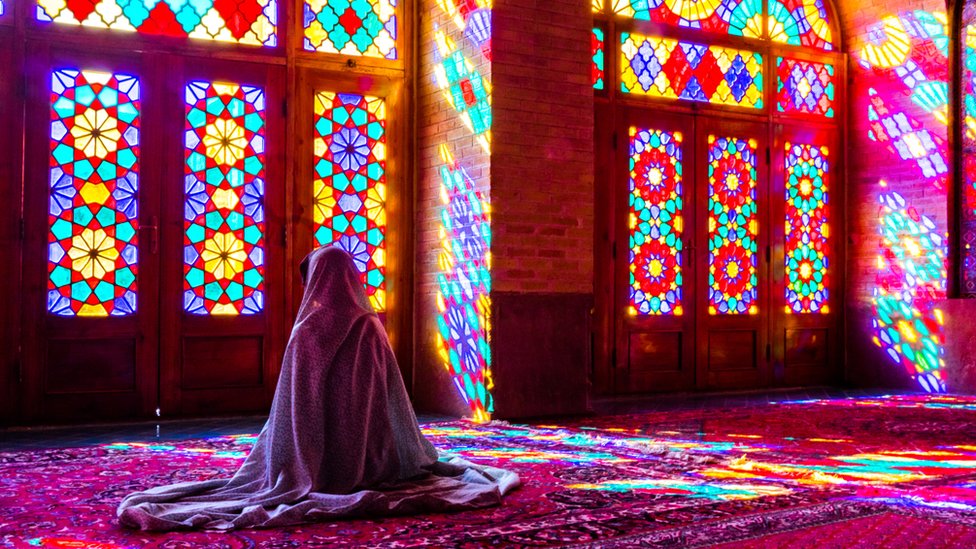 Woman praying in a Mosque