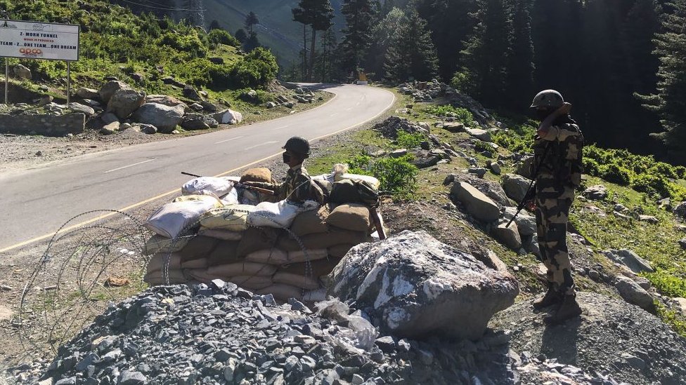 Indian Border Security Force (BSF) soldiers guard a highway leading towards Leh, bordering China, on June 17, 2020