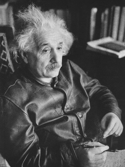 Portrait of Einstein, wearing a leather jacket and with his characteristic messy hair.
