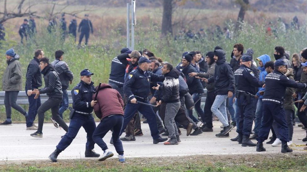 Migrants are stopped by the Bosnian police 200 metres from the border