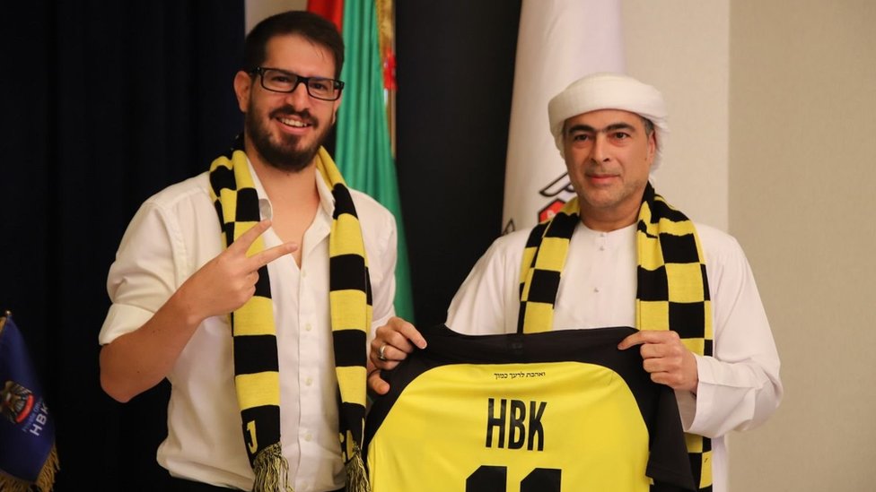 Al Nahyan (right) poses with a Beitar Jerusalem shirt alongside club owner Moshe Hogeg
