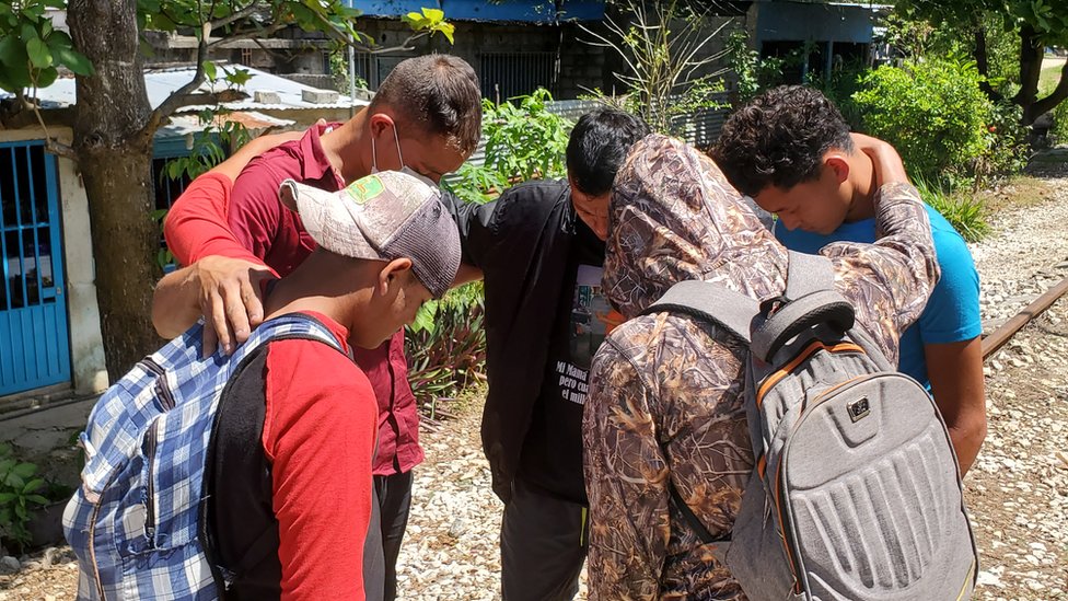Michael and friends pray in a group