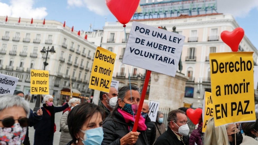 Supporters of a law to legalise euthanasia gather as the Spanish Parliament votes to approve it in Madrid, Spain