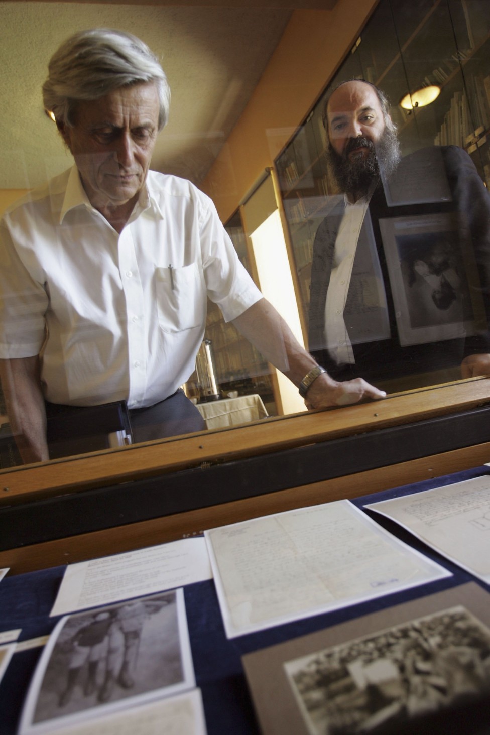 Professor Gutfreund (left) with Albert Einstein's papers held at the Hebrew University in Jerusalem, Israel