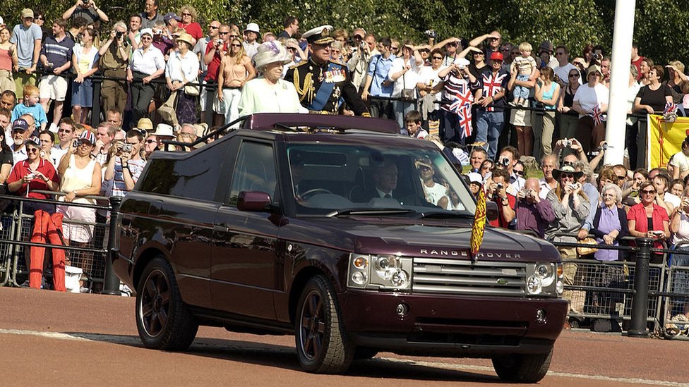 The Queen and Prince Philip in the back of a modified Range Rover on Commemoration Day