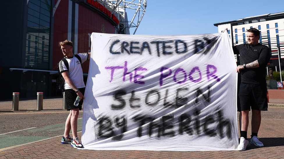 Fans told a banner reading: "Created by the poor, stolen by the rich" outside Old Trafford in Manchester