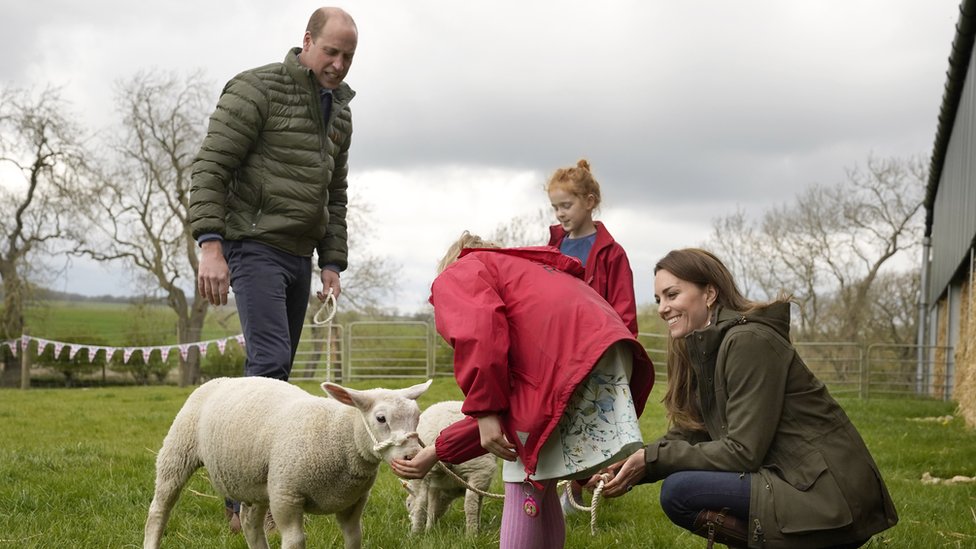 The Duke and Duchess of Cambridge with farmers daughters Clover 9, and Penelope Chapman, 7, during a visit to Manor Farm in Little Stainton, Durham