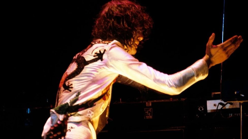 Jimmy Page playing the theremin during a Led Zeppelin show in the 1970s