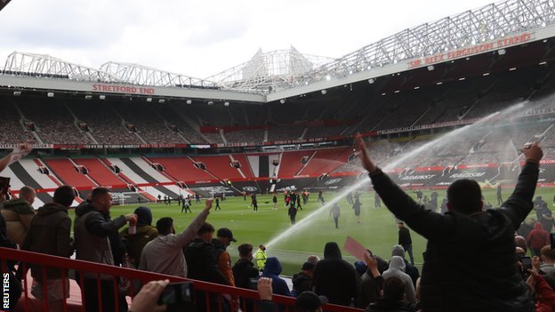 Fans on the Old Trafford pitch