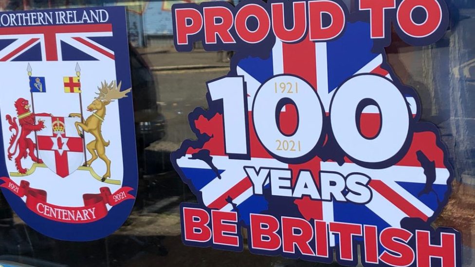 Proud to be British poster displayed in shop window
