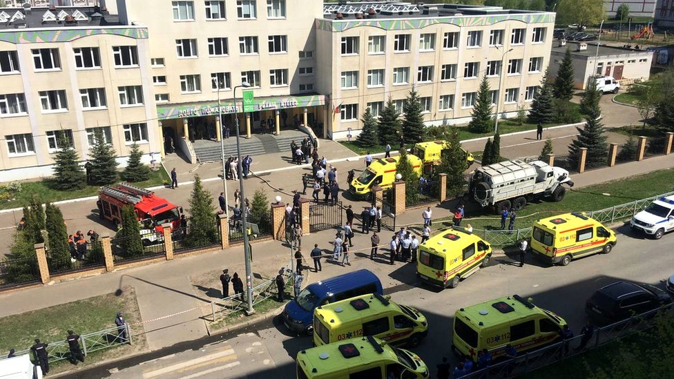 Ambulances and other emergency services vehicles outside the school in Kazan, Russia, 11 May 2021