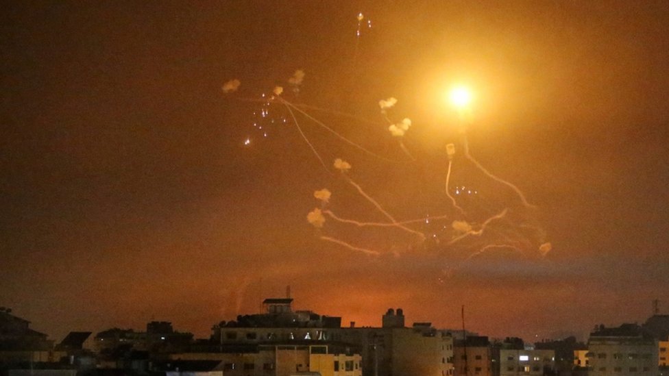 Israel's Iron Dome anti-missile system fires interceptor missiles as rockets are launched from the Gaza Strip towards Israel