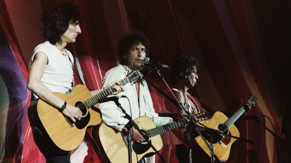Ronnie Wood, Bob Dylan and Keith Richards perform at Live Aid
