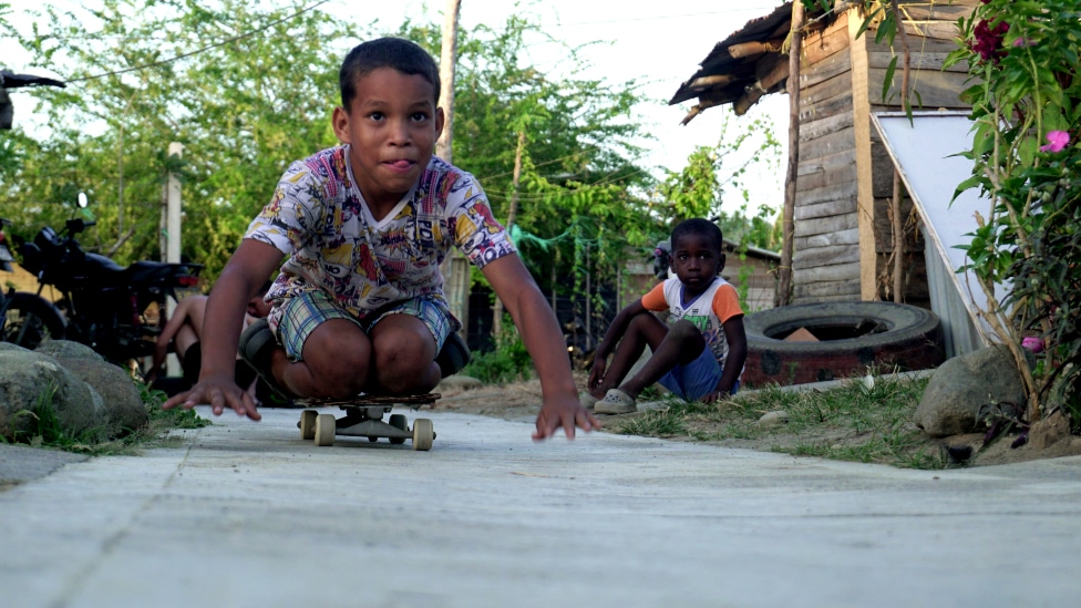 Boys playing on the street in Uraba