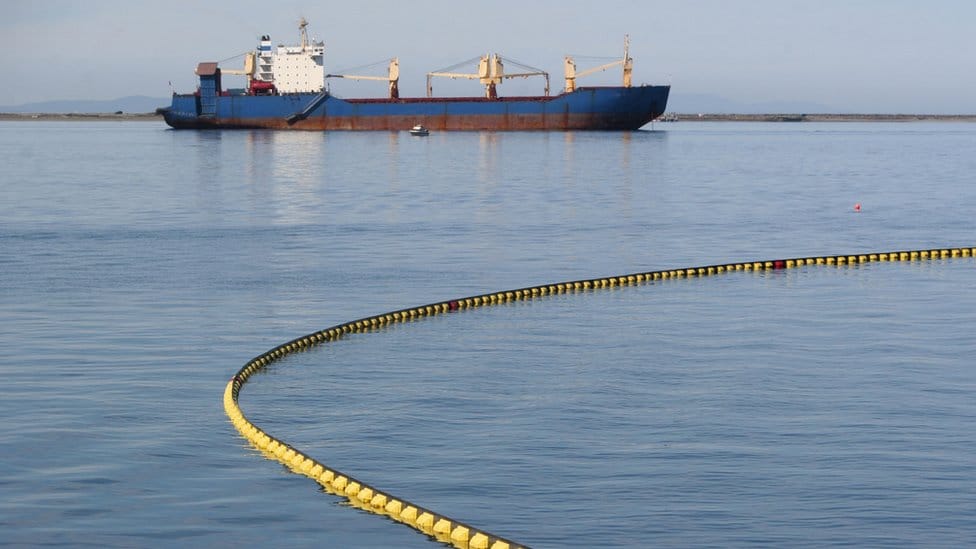 Oil spill boom in response to tanker leak