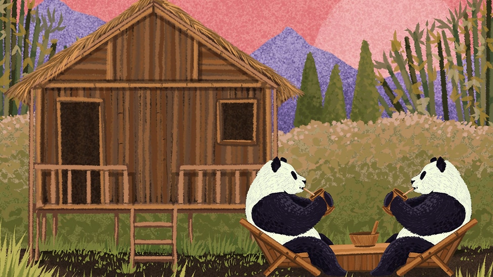 Two pandas having tea with a house made of bamboo in the background