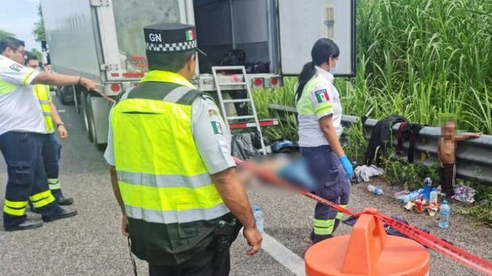 Police and immigration officers inspecting the scene where Wilder was found