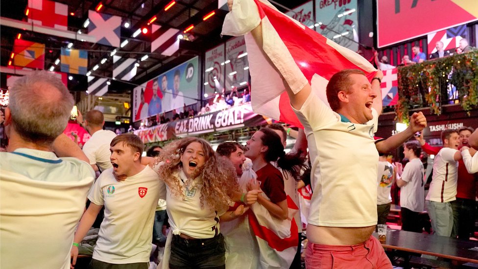 Fans at BOXPARK in Croydon celebrate England reaching the final after watching the Euro 2020 semi final match between England and Denmark.
