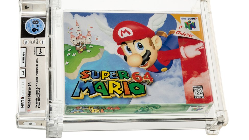Video igra Super Mario 64 prodata na aukciji za rekordnih 1,5 miliona dolara 1 A Super Mario 64 cartridge sealed in a plastic case with annotated grading info