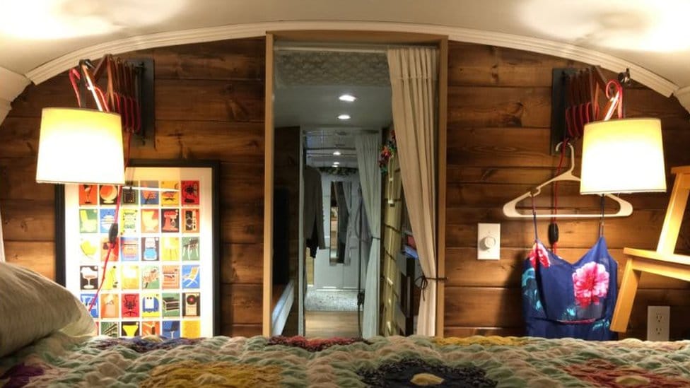 Master bedroom inside a school bus