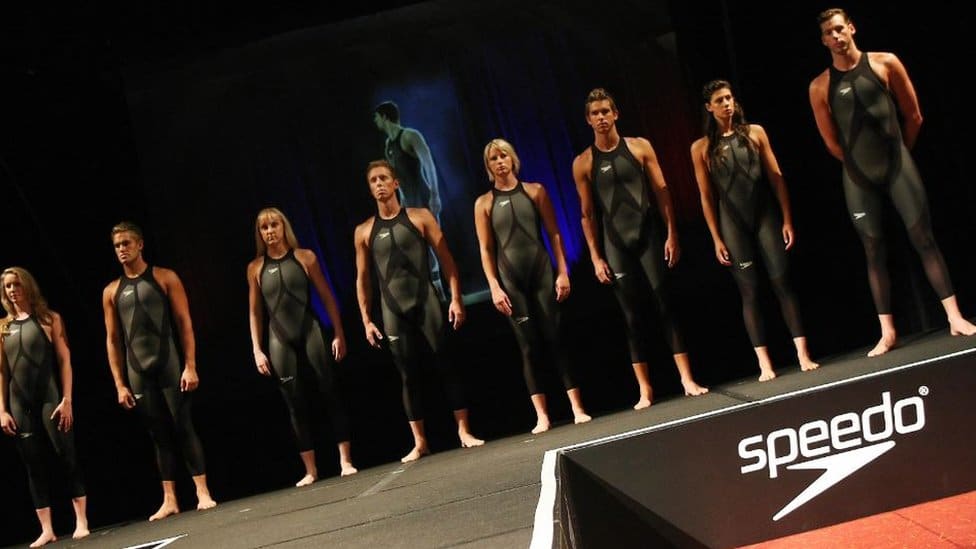NZ swimmers posing with the specially designed swimsuits