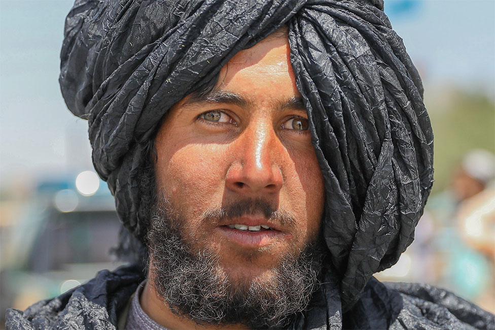 A Taliban fighter poses for a photograph in Kabul, Afghanistan, 16 August 2021