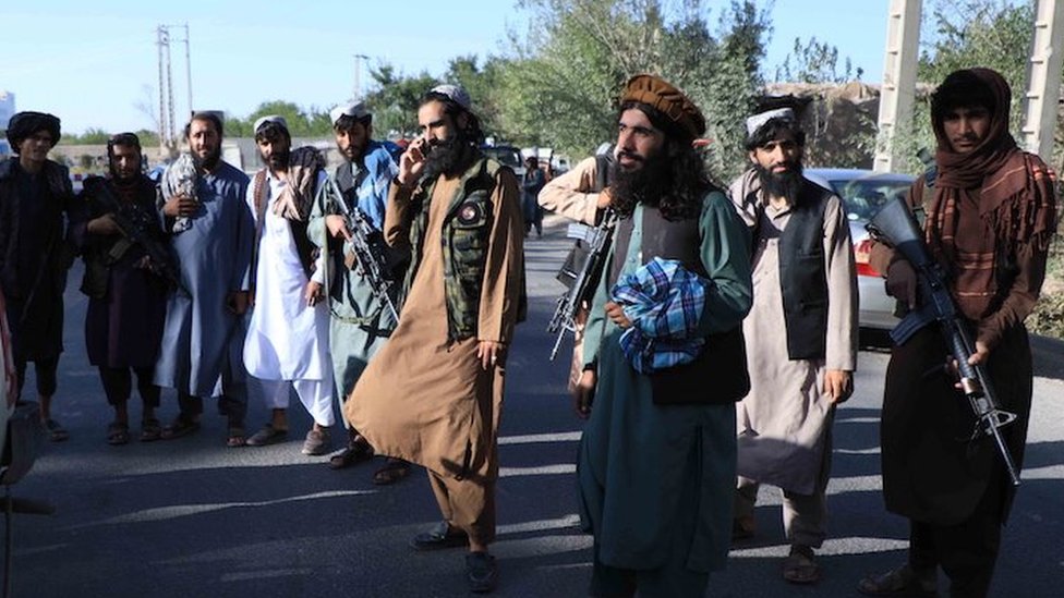Taliban stand guard at a checkpoint as they took control of Herat, Afghanistan, 15 August 2021