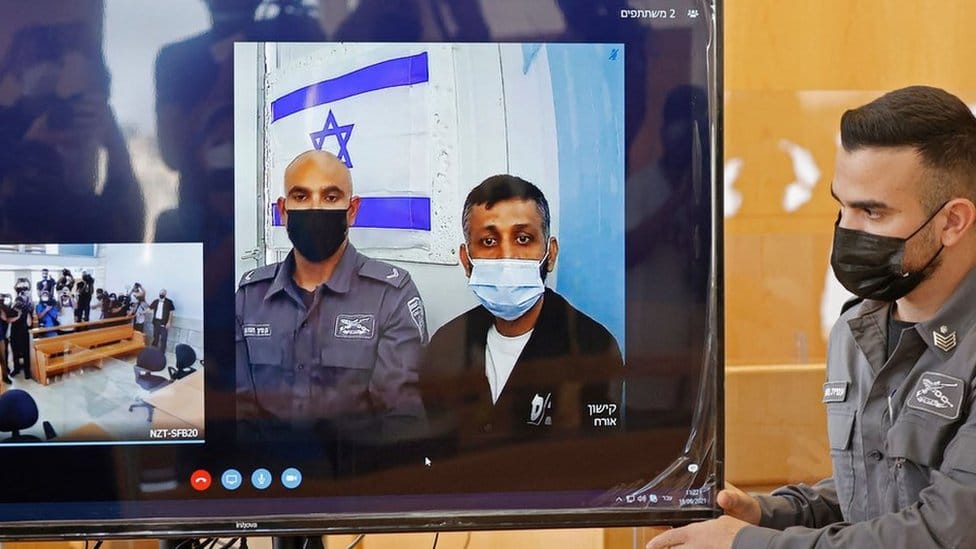 Palestinian militant Mohammad Ardah (C) attends via Zoom a court session in the Israeli city of Nazareth on September 19, 2021. - Ardah, one of the six Palestinian militants who escaped from a high-security prison, was recaptured on September 11. All six Palestinian fugitives who escaped a high-security Israeli jail through a tunnel dug under a sink are back in custody, after the Israeli army said it had recaptured the last two. (Photo by JACK GUEZ / AFP) (Photo by JACK GUEZ/AFP via Getty Images)