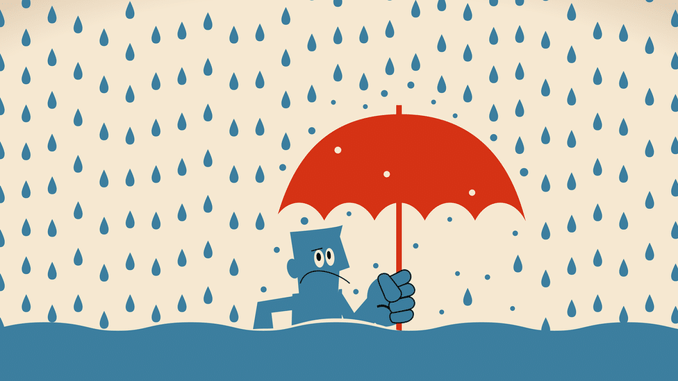 Illustration showing a person standing in a flood of water holding an umbrella