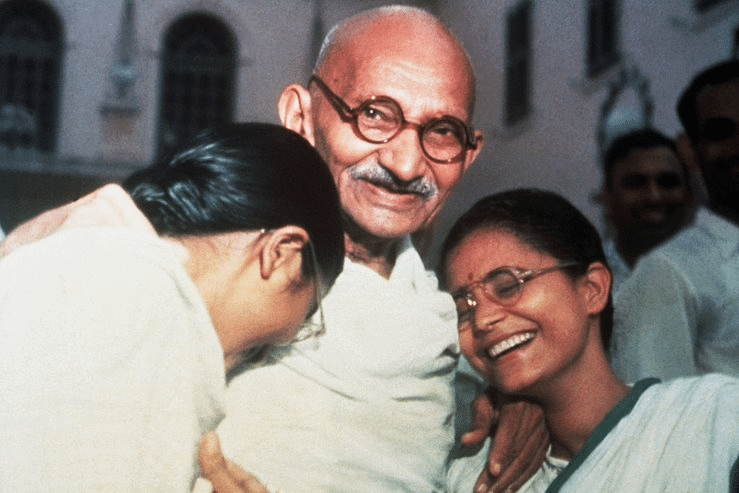 Mahatma Ghandi enjoys a laugh with his two granddaughters, Ava and Manu