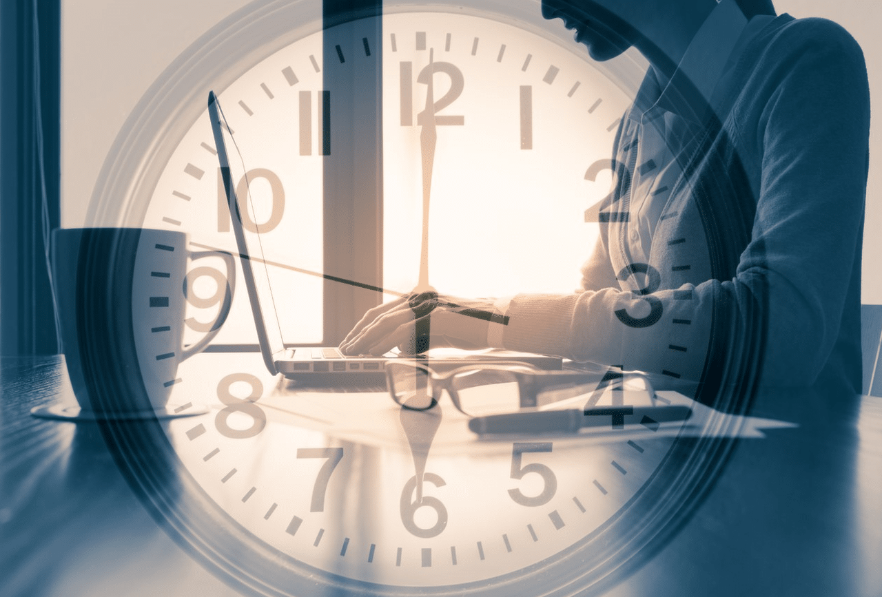 An image of a clock superimposed over a woman typing at daybreak