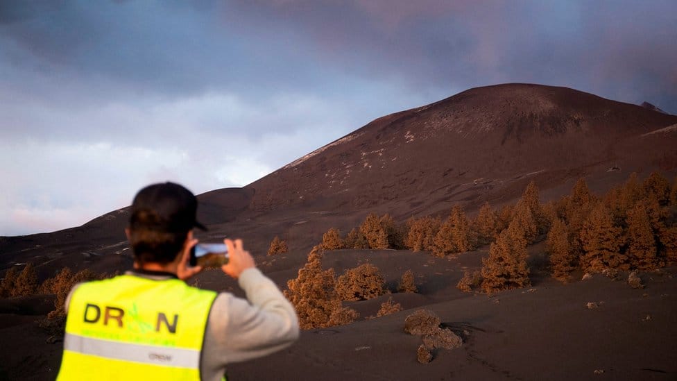 Man watches volcano