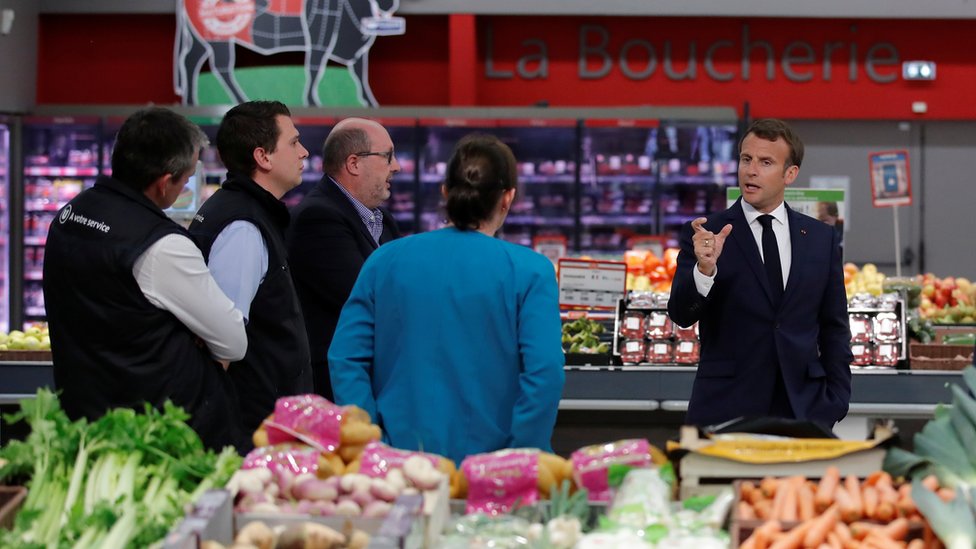 French president Macron visits a supermarket