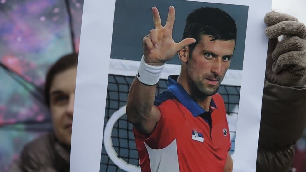 A supporter of Serbian tennis player Novak Djokovic holds a photo during a protest of support in Belgrade, Serbia, 08 January 2022.