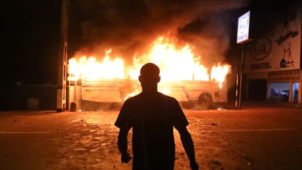 A vehicle burning during a protest in Sri Lanka