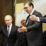 Russian President Vladimir Putin (L) and Serbian President Aleksandar Vucic (C)