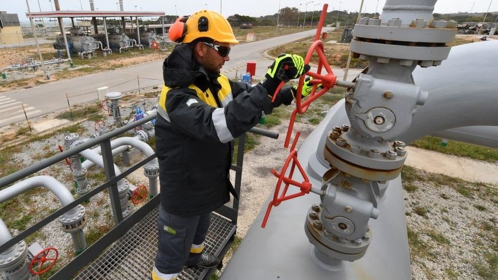 An employee works at the Tunisian Sergaz company, that controls the Tunisian segment of the Trans-Mediterranean (Transmed) pipeline, through which natural gas flows from Algeria to Italy, in El-Haouaria, some 100km east of the capital Tunis, on April 14, 2022