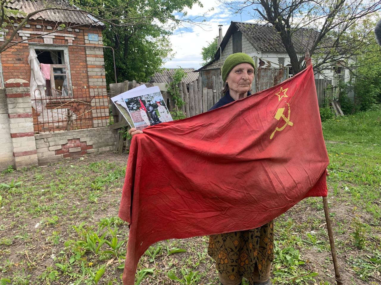 grandmother with red flag