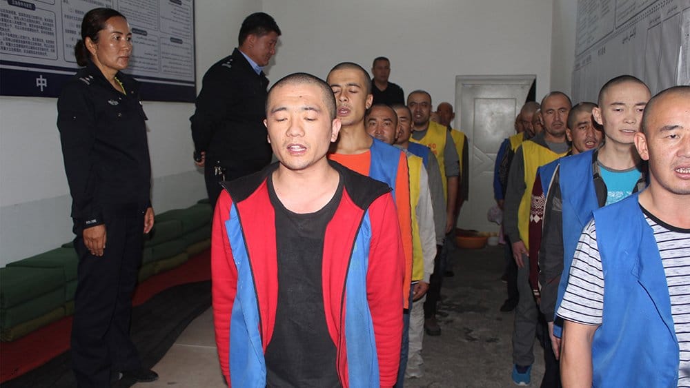 Detainees appear to be subjected to indoctrination sessions