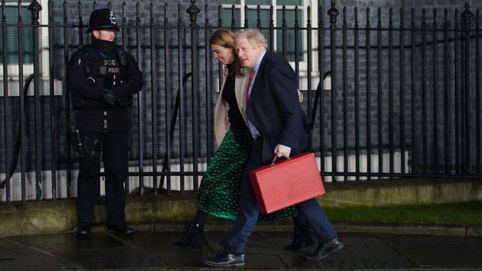 Boris Johnson and his partner Carrie Symonds enter Downing Street as the Conservatives celebrate a sweeping election victory on December 13, 2019