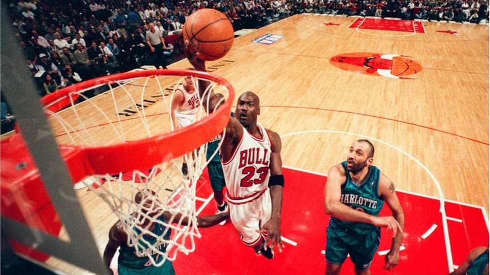 Michael Jordan going for a basket during a 1998-99 season NBA game