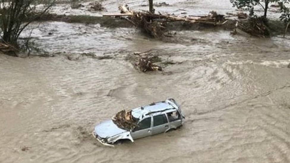 Flooded car seen after heavy rains in Carinthia, Austria