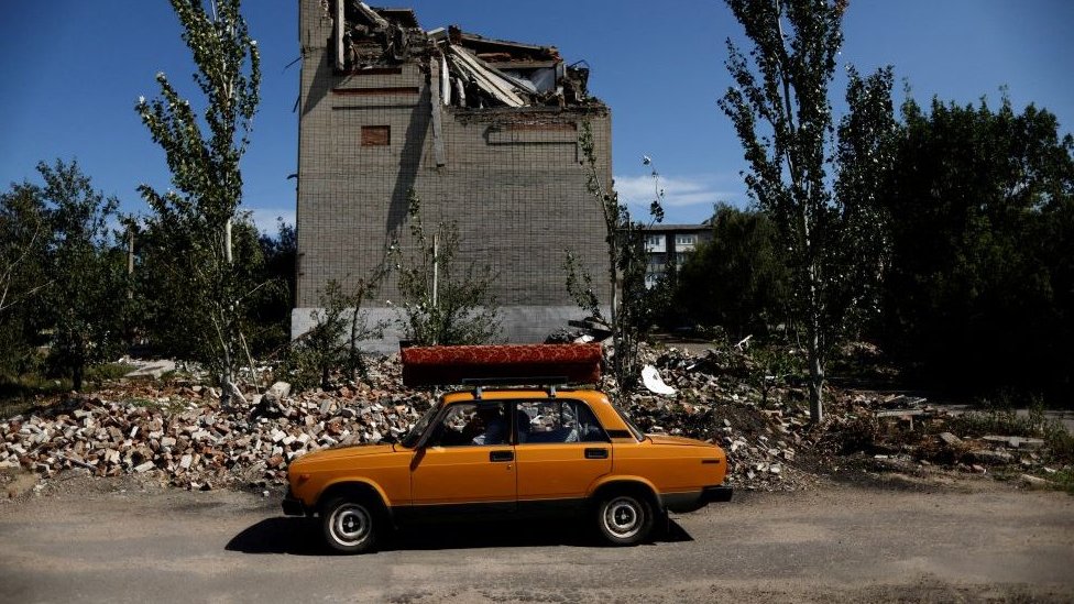 62-year-old Ukrainian Arkadii drives a car after leaving his destroyed house, as Russia's attack on Ukraine continues, in Toretsk, Donetsk region, Ukraine August 22, 2022. REUTERSAmmar Awad TPX IMAGES OF THE DAY