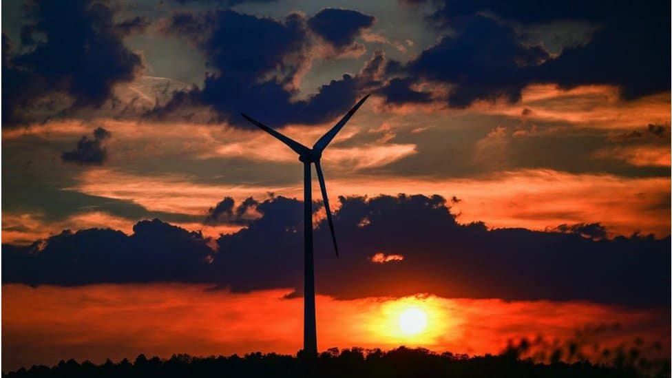 A wind turbine at sunset in Germany